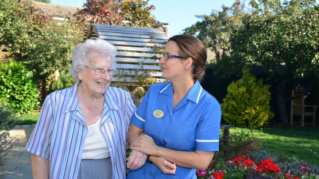 A nurse looking after a resident who is staying at Springfield Care Homes receiving respite care